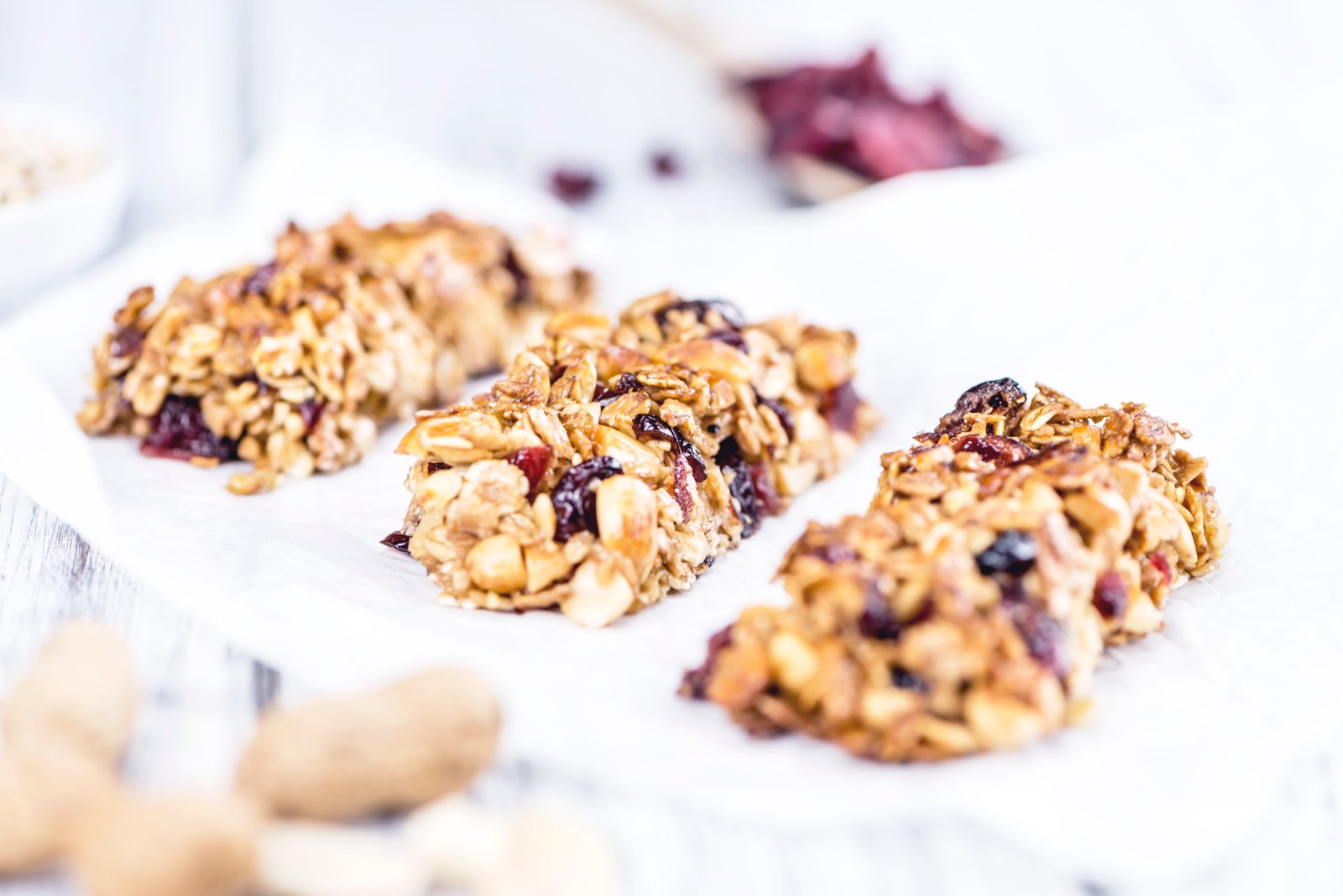 Oat and dried fruit granola bars on parchment paper
