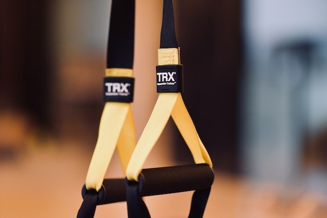 Empower Your Wellness: Why Every Woman Should Try TRX Training!, TRX Training straps hanging in a gym